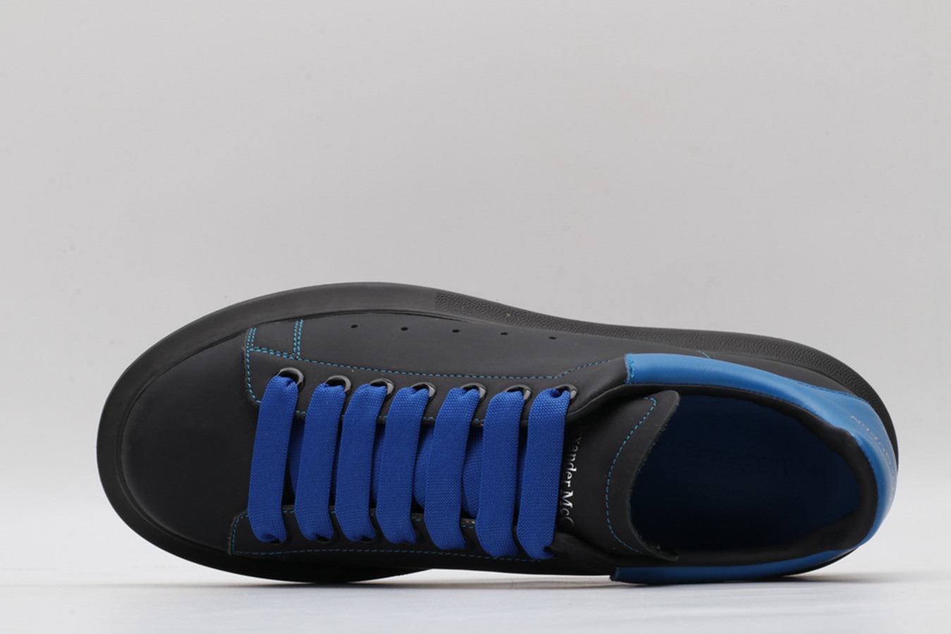 AMQ black oversized sneakers with blue heel