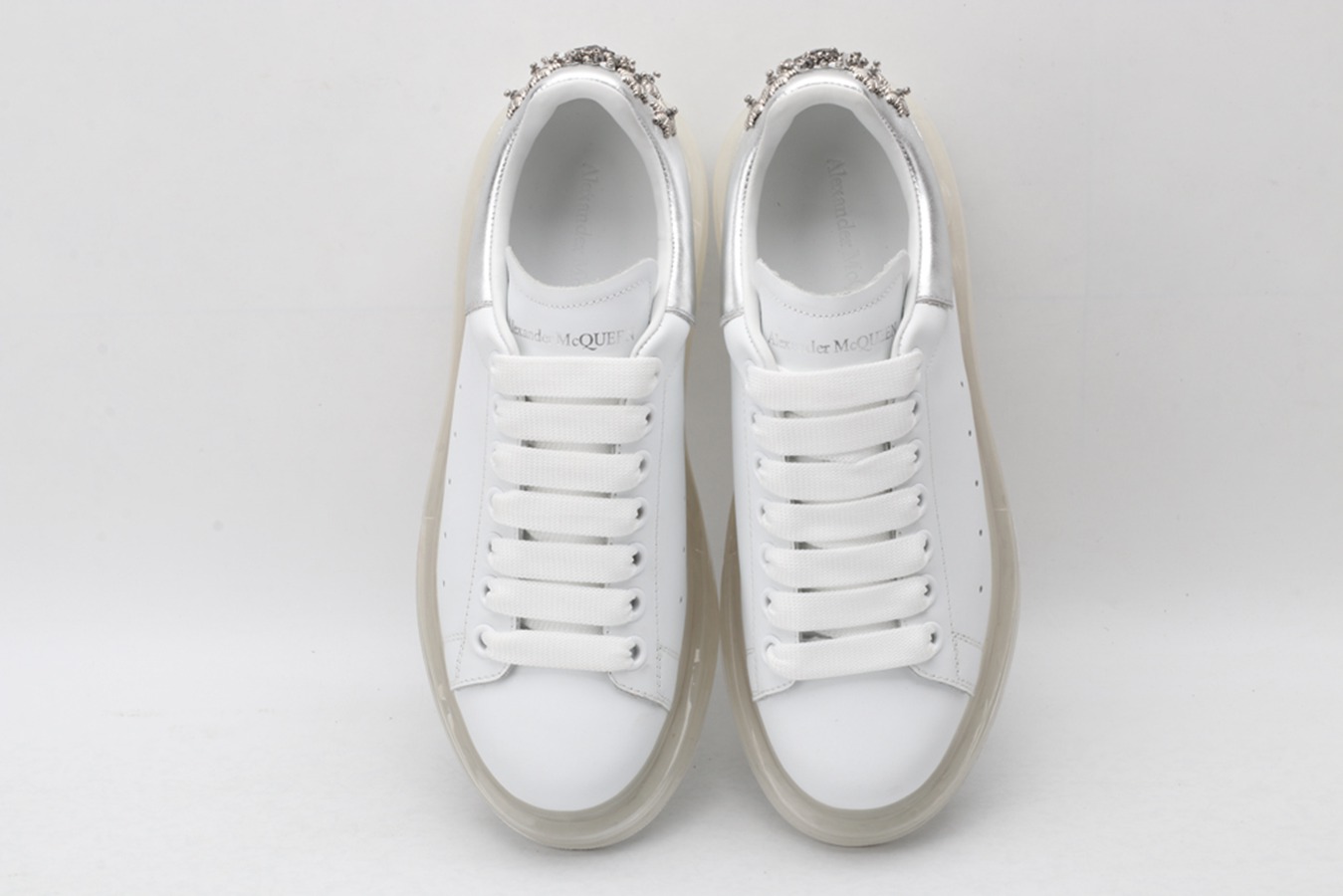 AMQ white oversized sneakers with siL*Ver heel