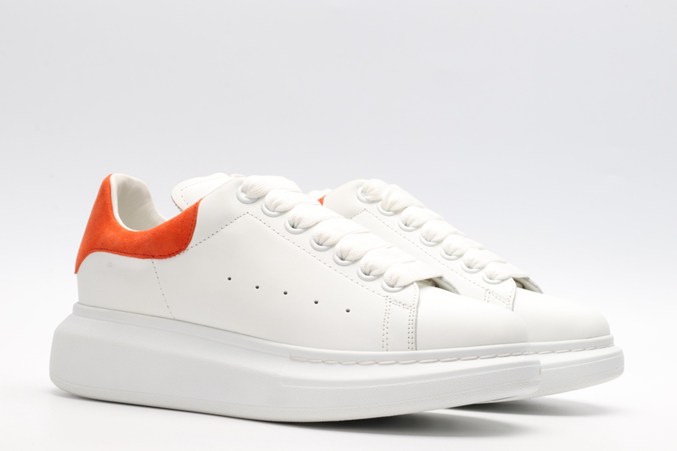 AMQ OVERSIZED SNEAKER with orange heel