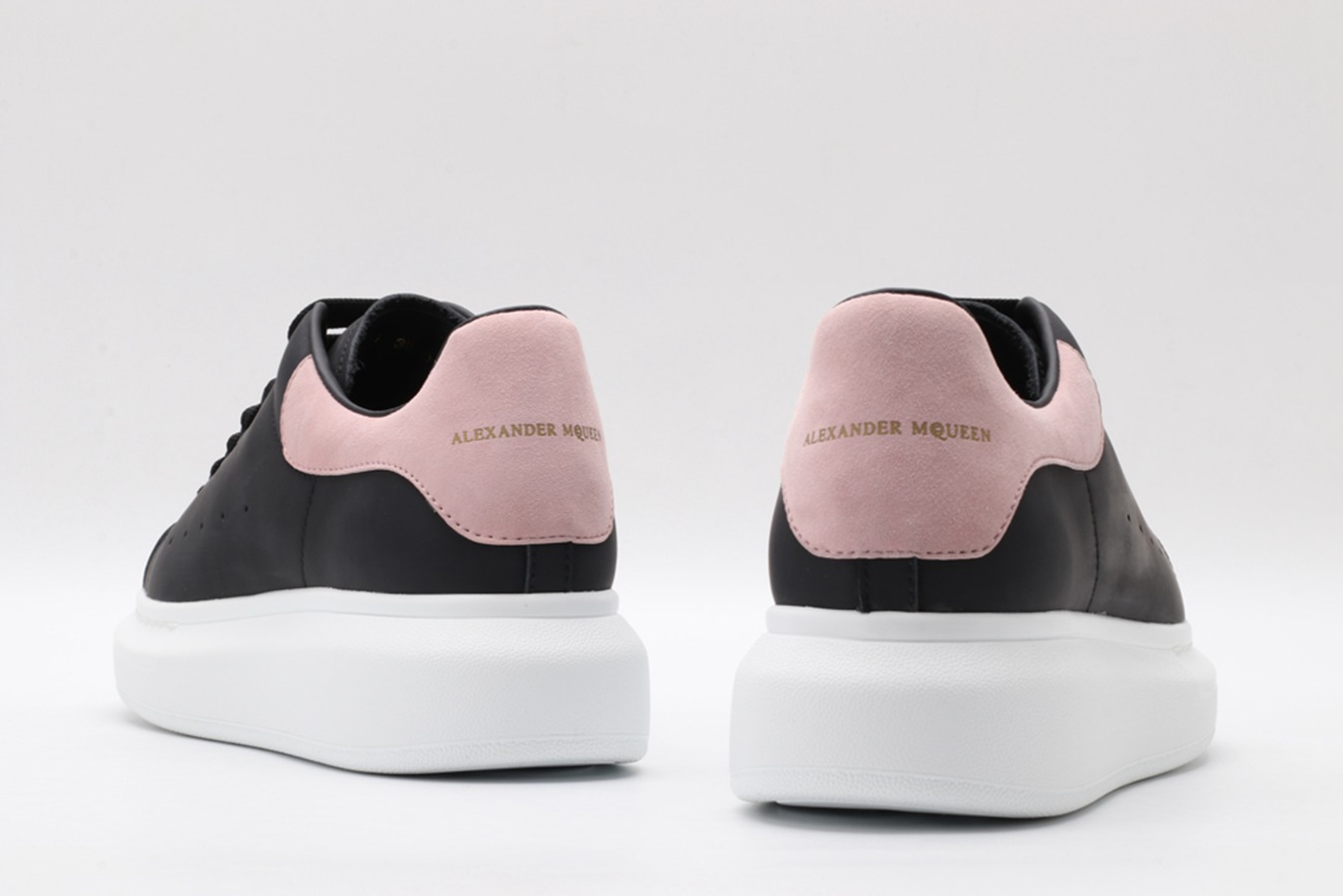 AMQ oversized black sneakers with rose heel