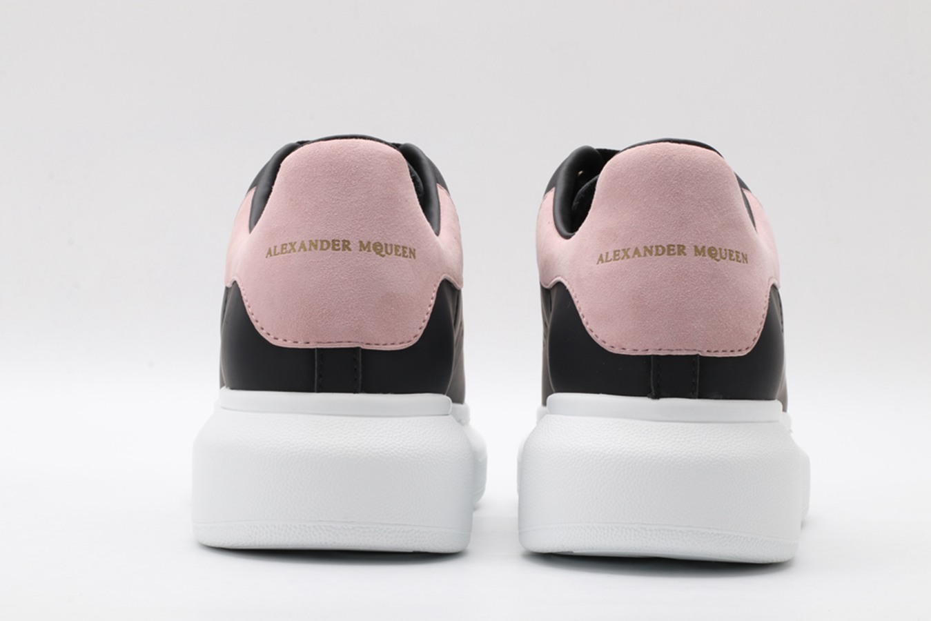 AMQ oversized black sneakers with rose heel