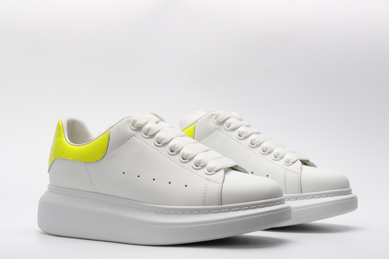 AMQ yellow foil embellished chunky leather sneakers