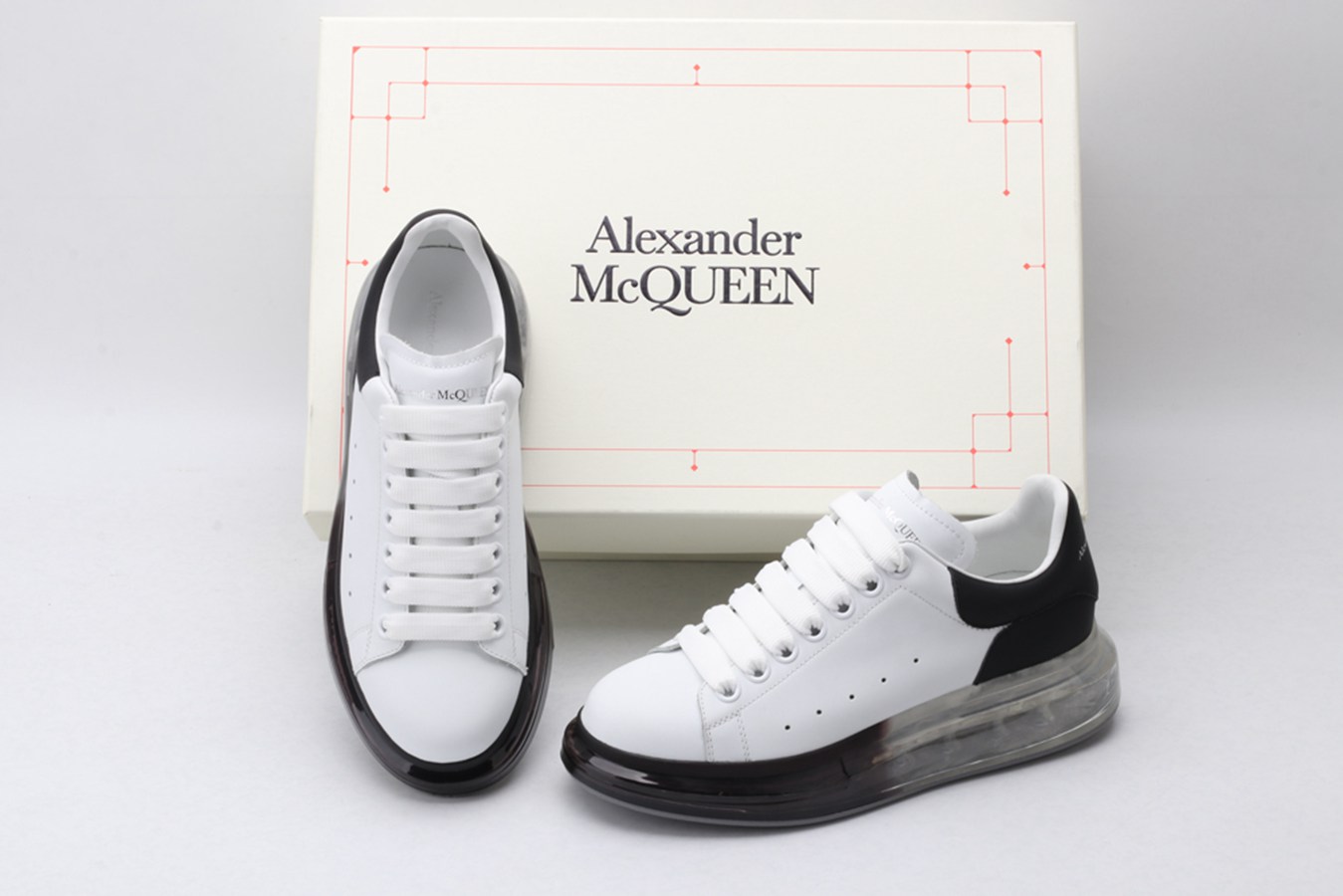 AMQ white oversized sneakers with black heel