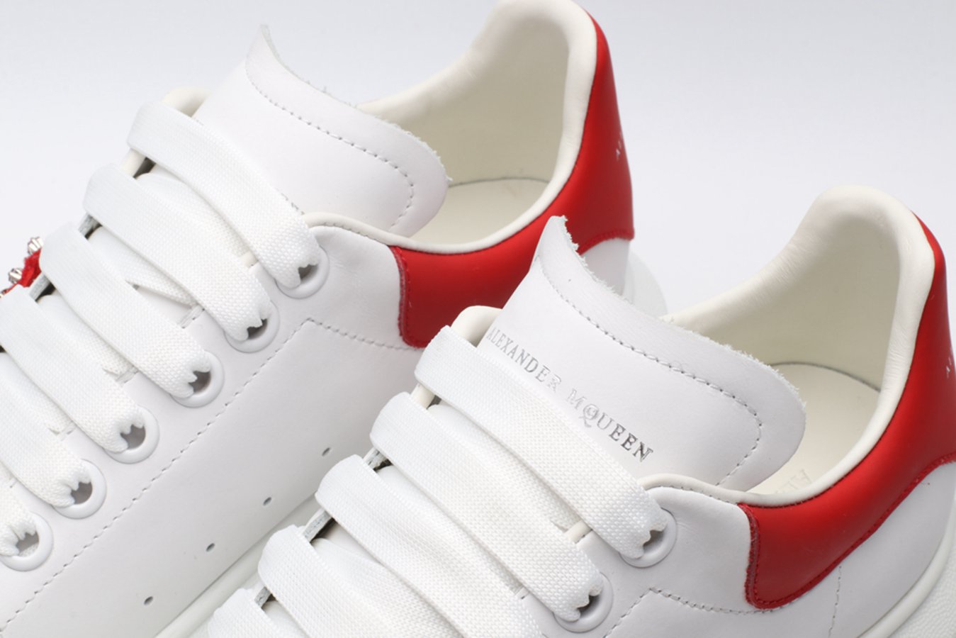 AMQ oversized sneakers with red heel