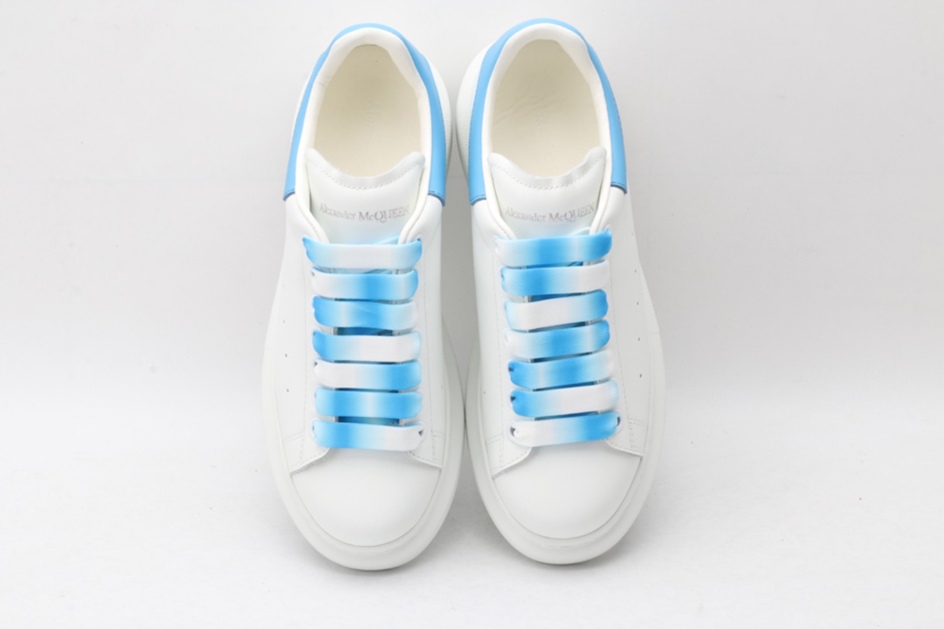 AMQ oversized sneakers with sky blue heel