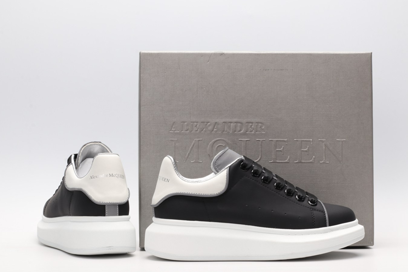 AMQ black oversized sneakers with siL*Ver heel
