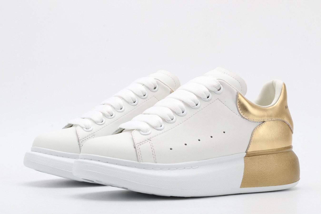 AMQ oversized sneakers with gold heel