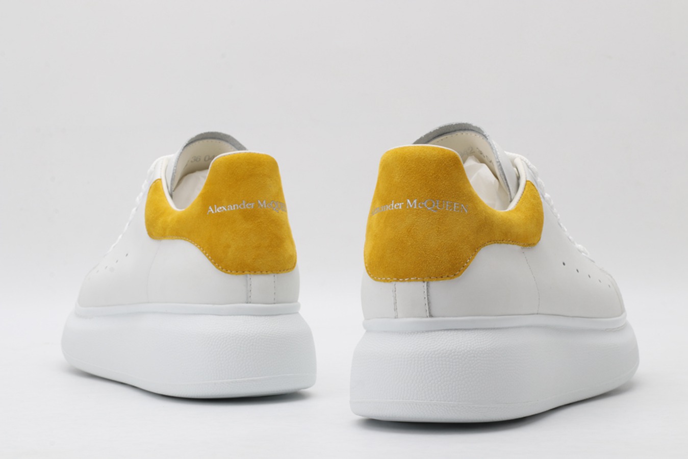 AMQ oversized sneakers with yellow heel