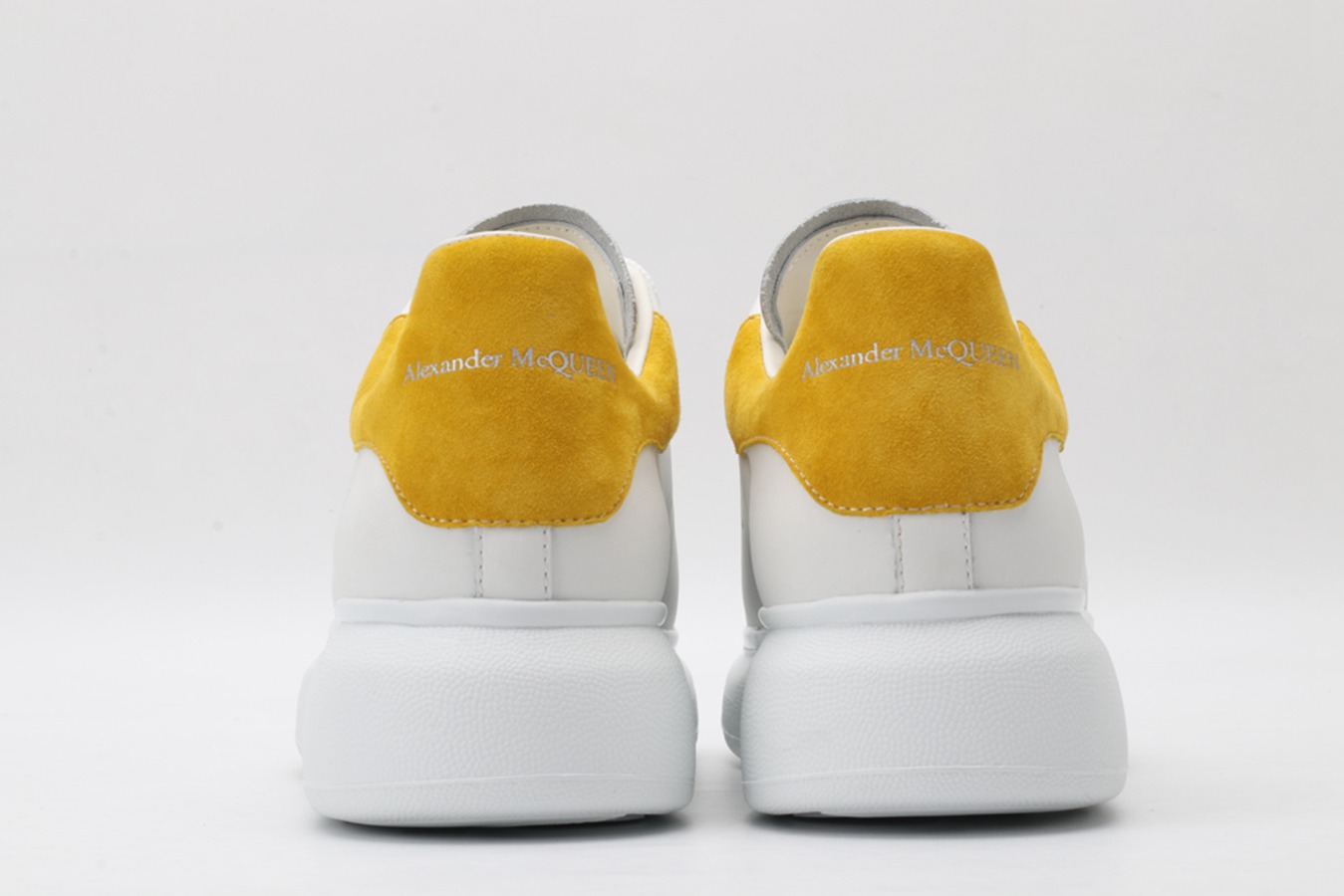 AMQ oversized sneakers with yellow heel