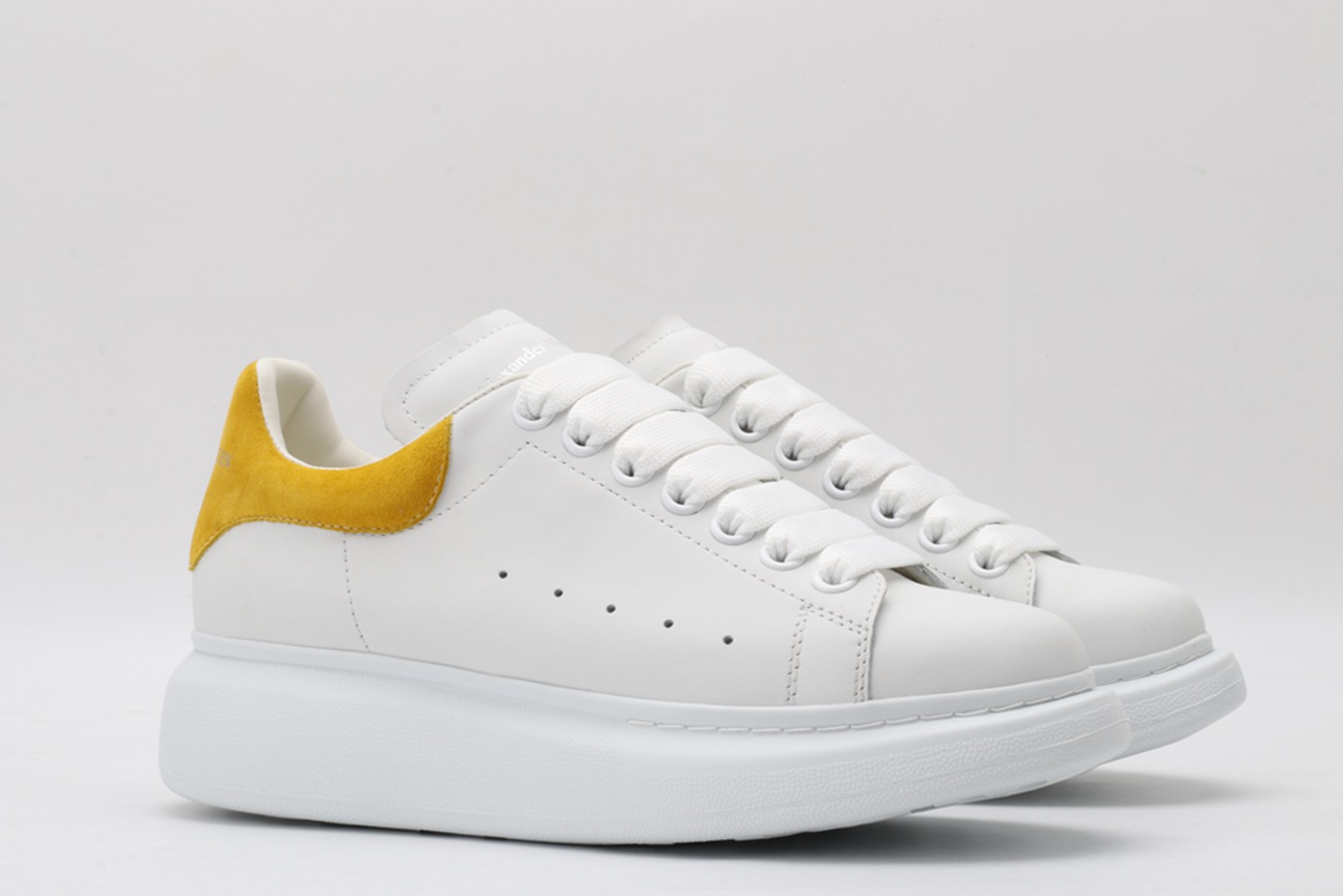 AMQ oversized sneakers with yellow heel