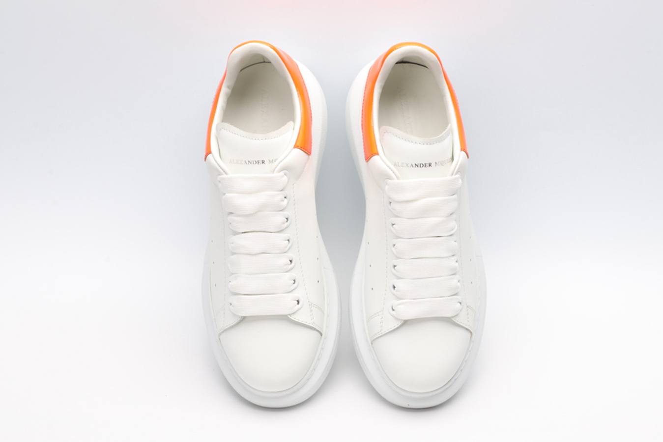 AMQ OVERSIZED SNEAKER with orange heel