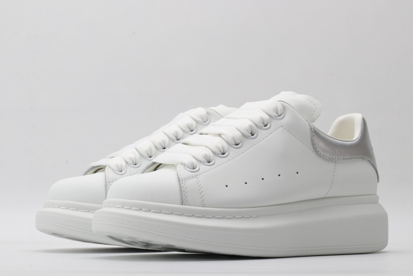 AMQ oversized sneakers with siL*Ver heel