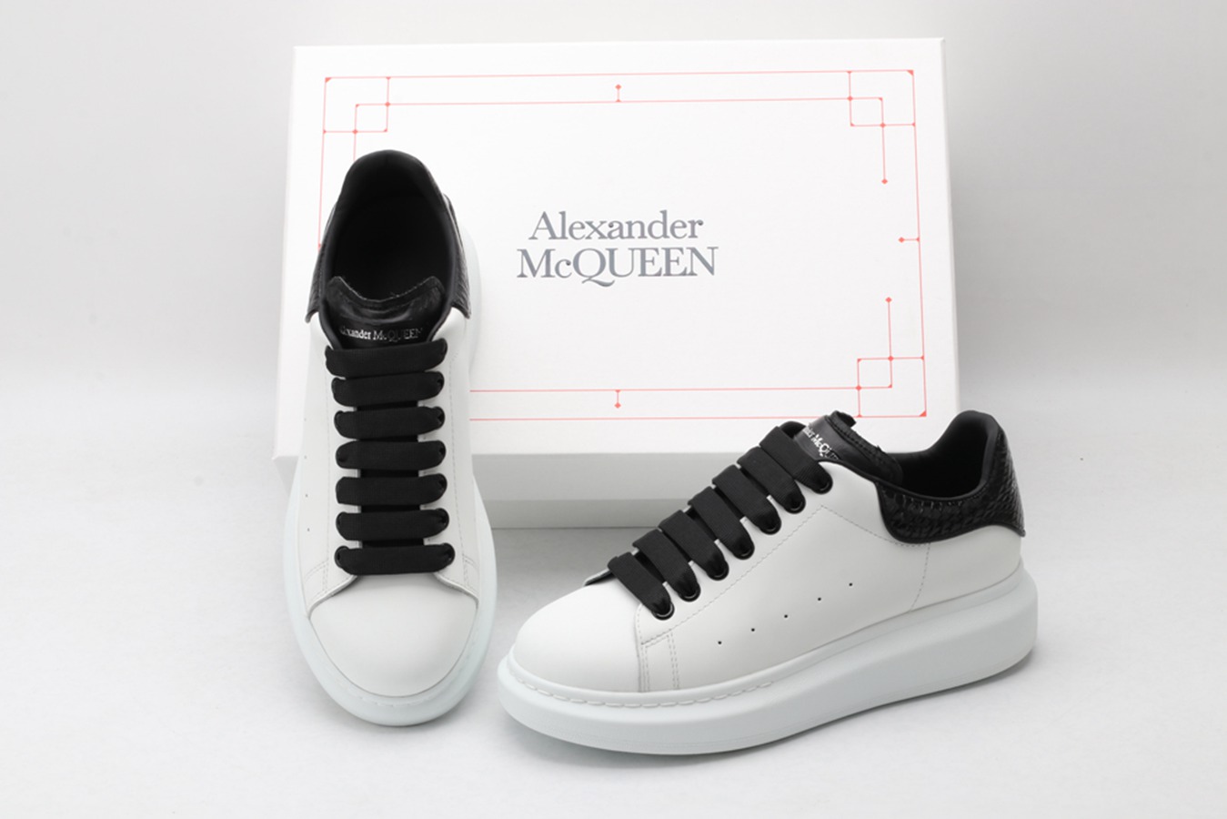 AMQ OVERSIZED SNEAKER with blue stamped python heel