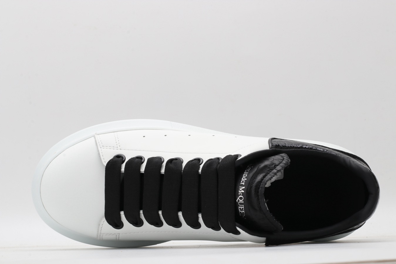 AMQ OVERSIZED SNEAKER with blue stamped python heel