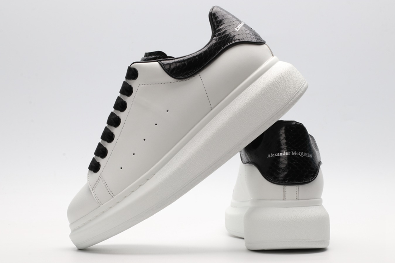 AMQ OVERSIZED SNEAKER with blue stamped python heel