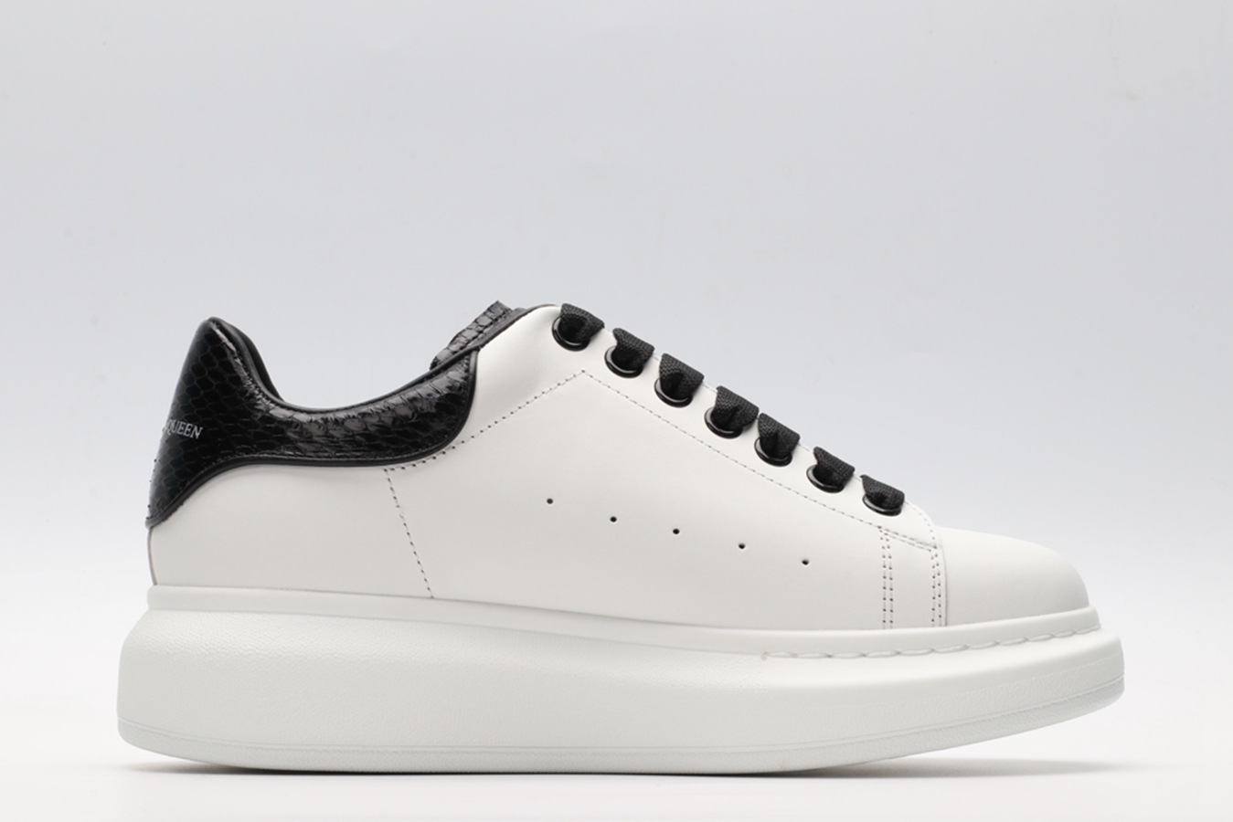 AMQ OVERSIZED SNEAKER with blue stamped python heel