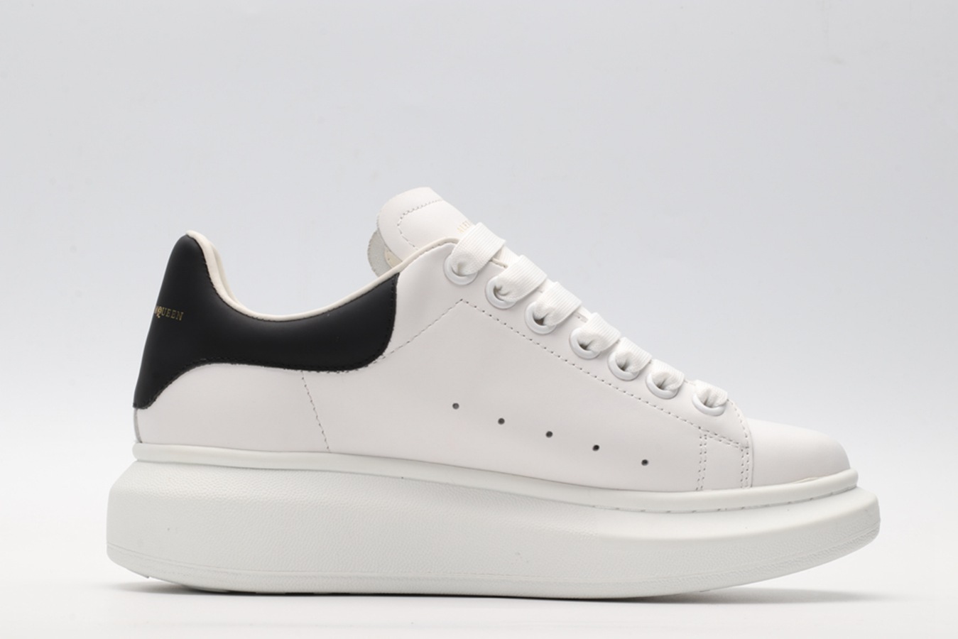AMQ white oversized sneakers with black heel