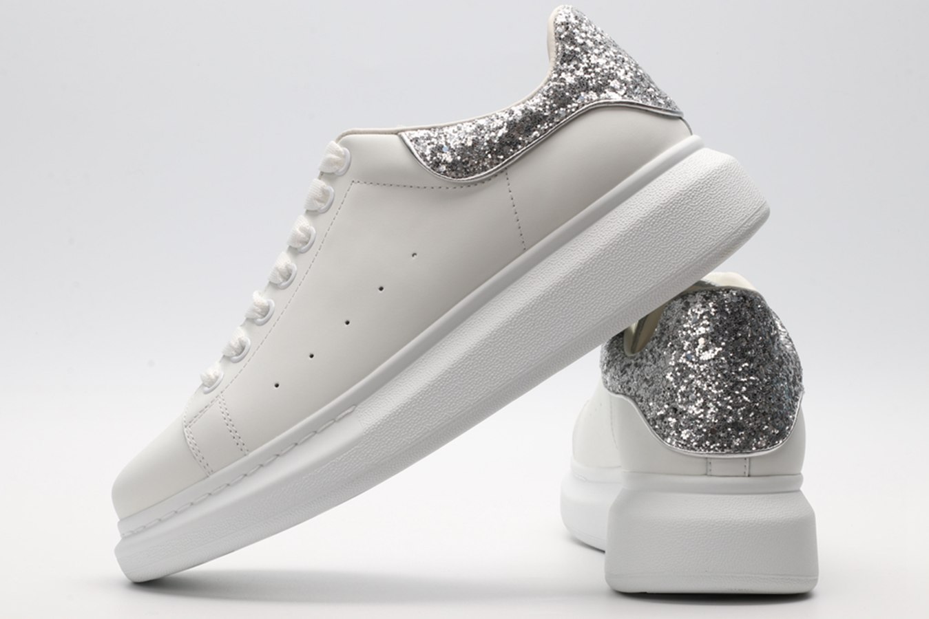 AMQ oversized sneakers with siL*Ver heel